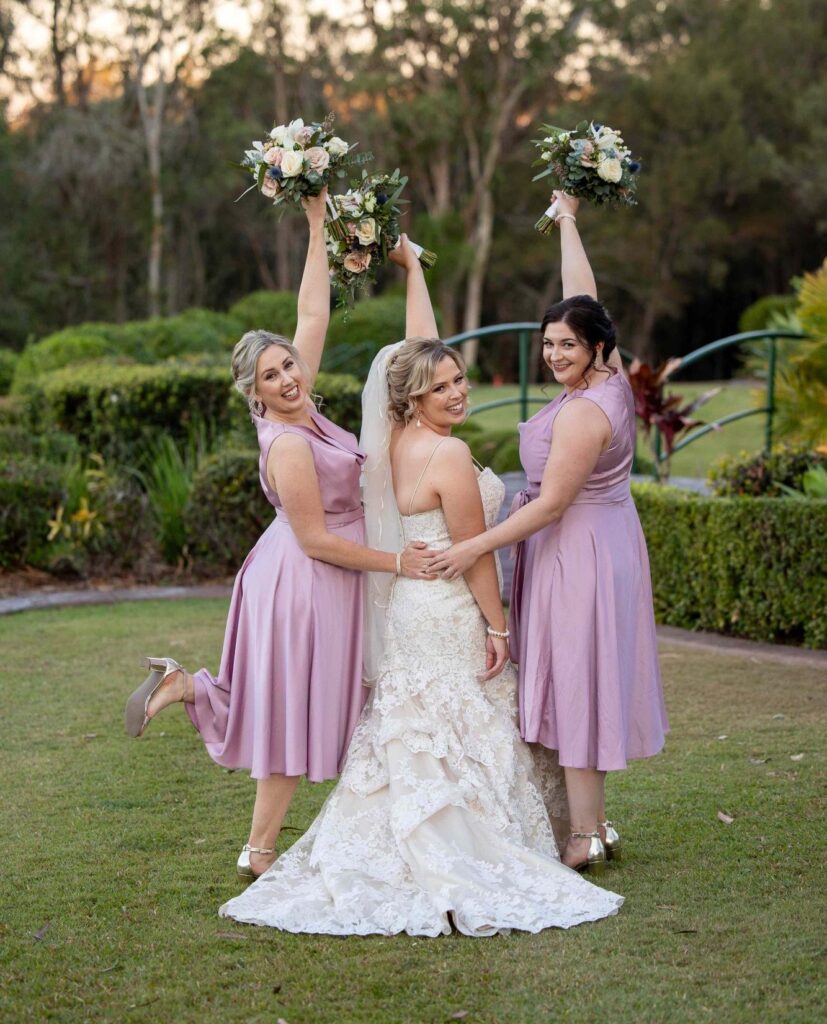 bridal party throwing bouquet